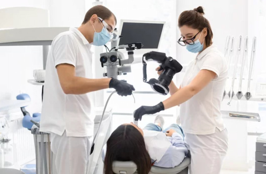 dentists working with a patient
