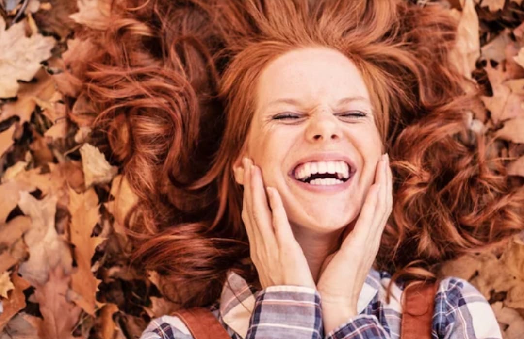 a red hair woman laughing