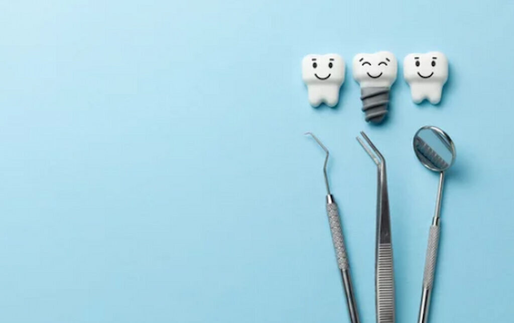 dental tools and teeth models on the blue background
