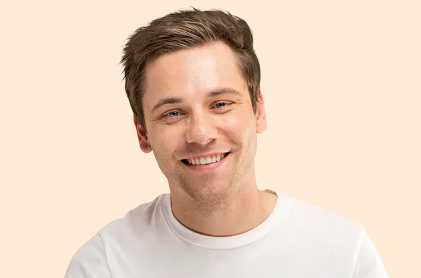a portrait of a young man smiling