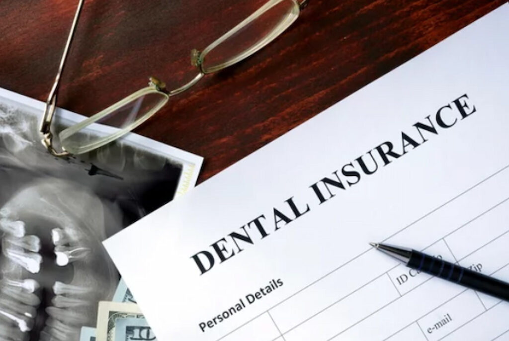 dental insurance form and glasses