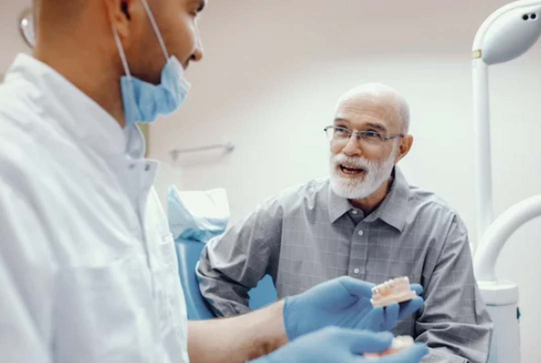 an elderly man visiting the dentist