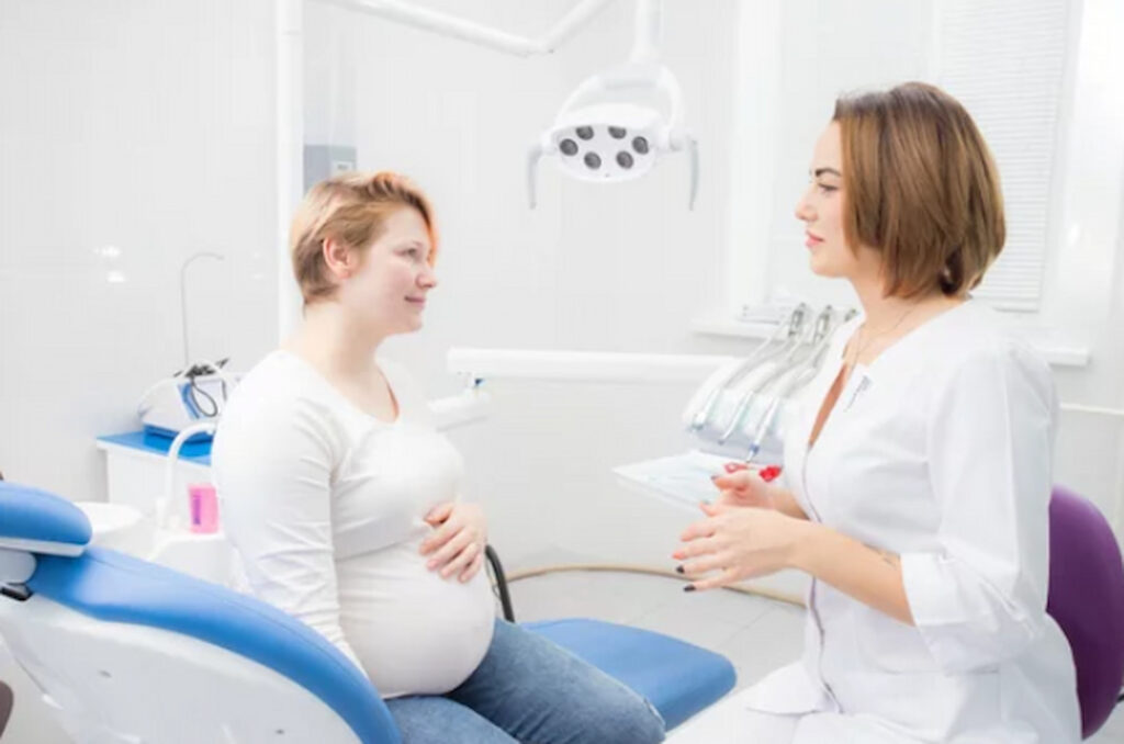 a pregnant woman visiting the dentist