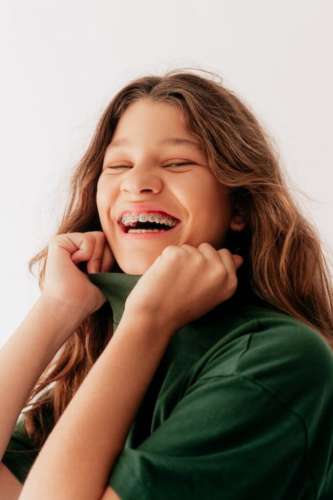 a young woman wearing braces