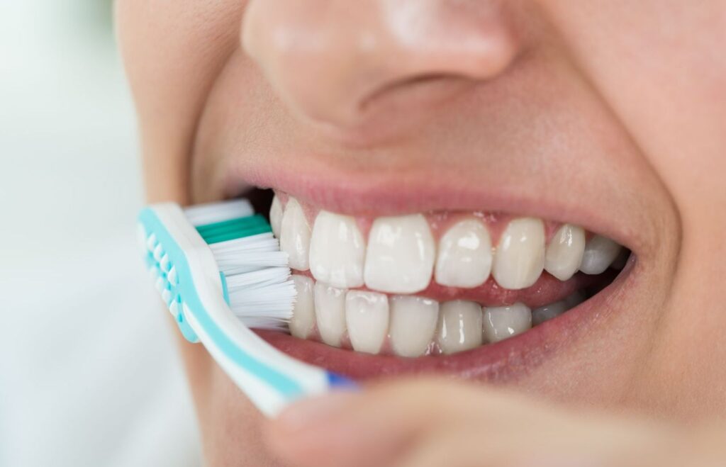 a person brushing their teeth