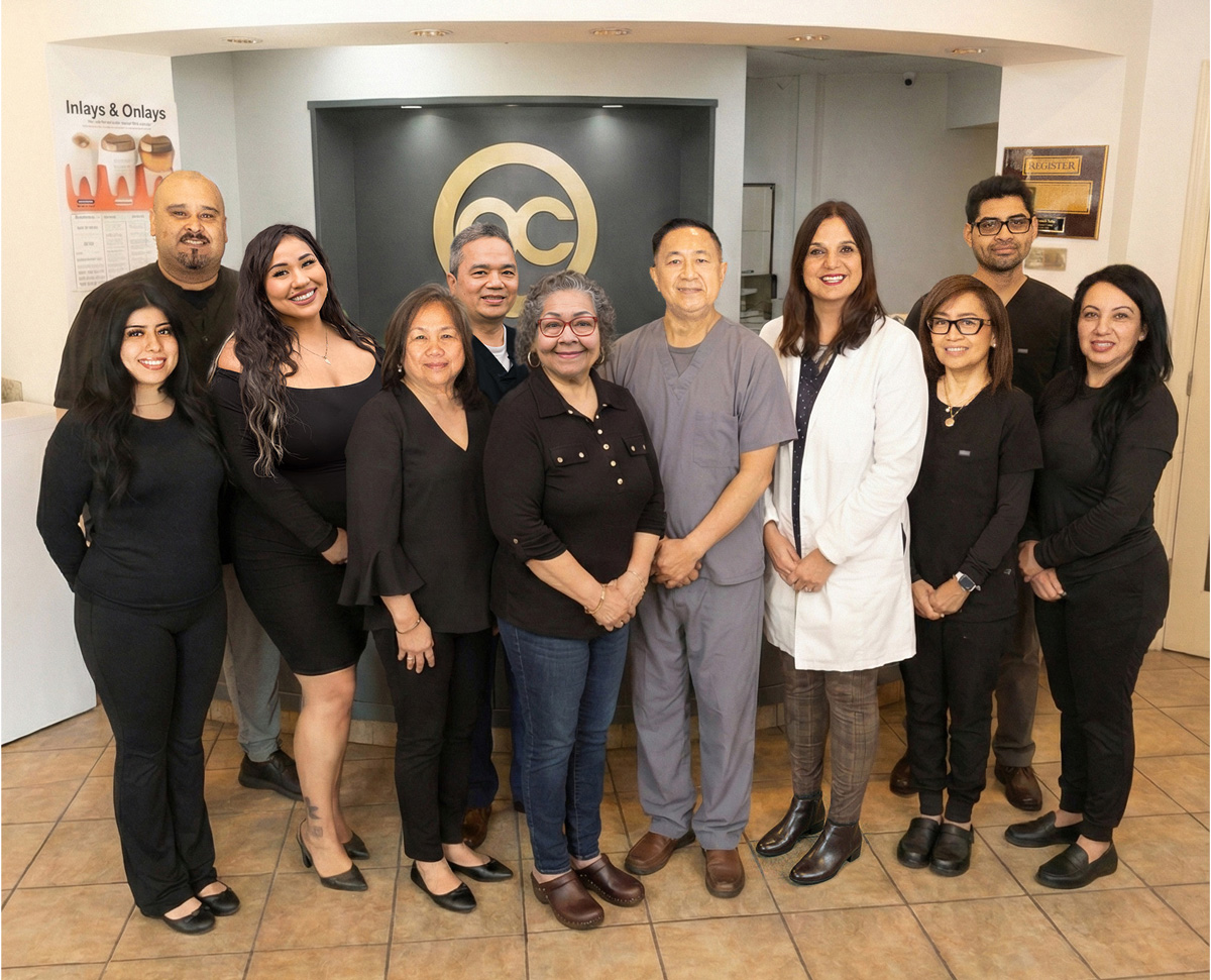 Friendly dental team helping a patient feel comfortable at OC Dental Center